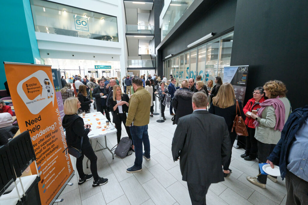people standing in foyer at event at ayrshire college
